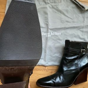 Stéphane Kélian shiny black leather wedge booties